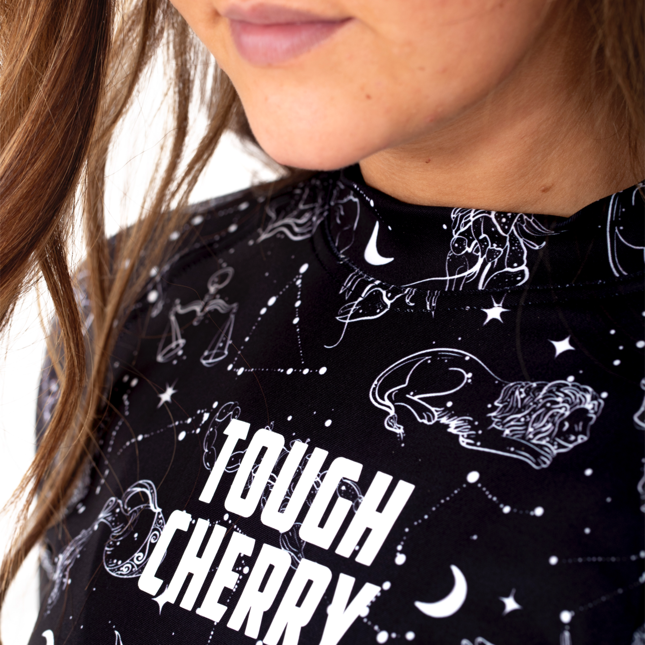Women's and Girls Long and short sleeved rash guard, constellation and star sign black and white print, logo view