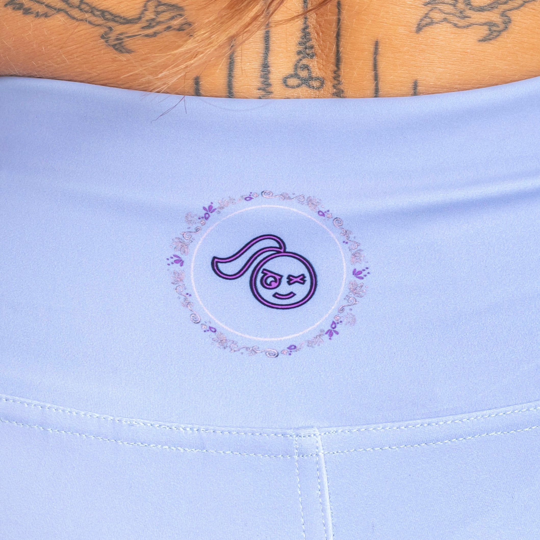 back of lilac shorts with tough cherry logo