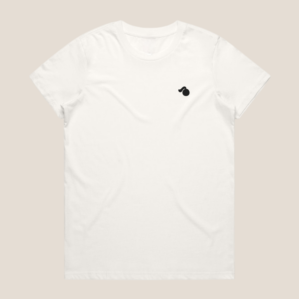 White oversized cotton t-shirt with a small black tough cherry logo on a beige background