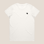 White oversized cotton t-shirt with a small black tough cherry logo on a beige background