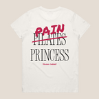 White oversized cotton t-shirt with 'Pain Princess' text in black and pink on a beige background