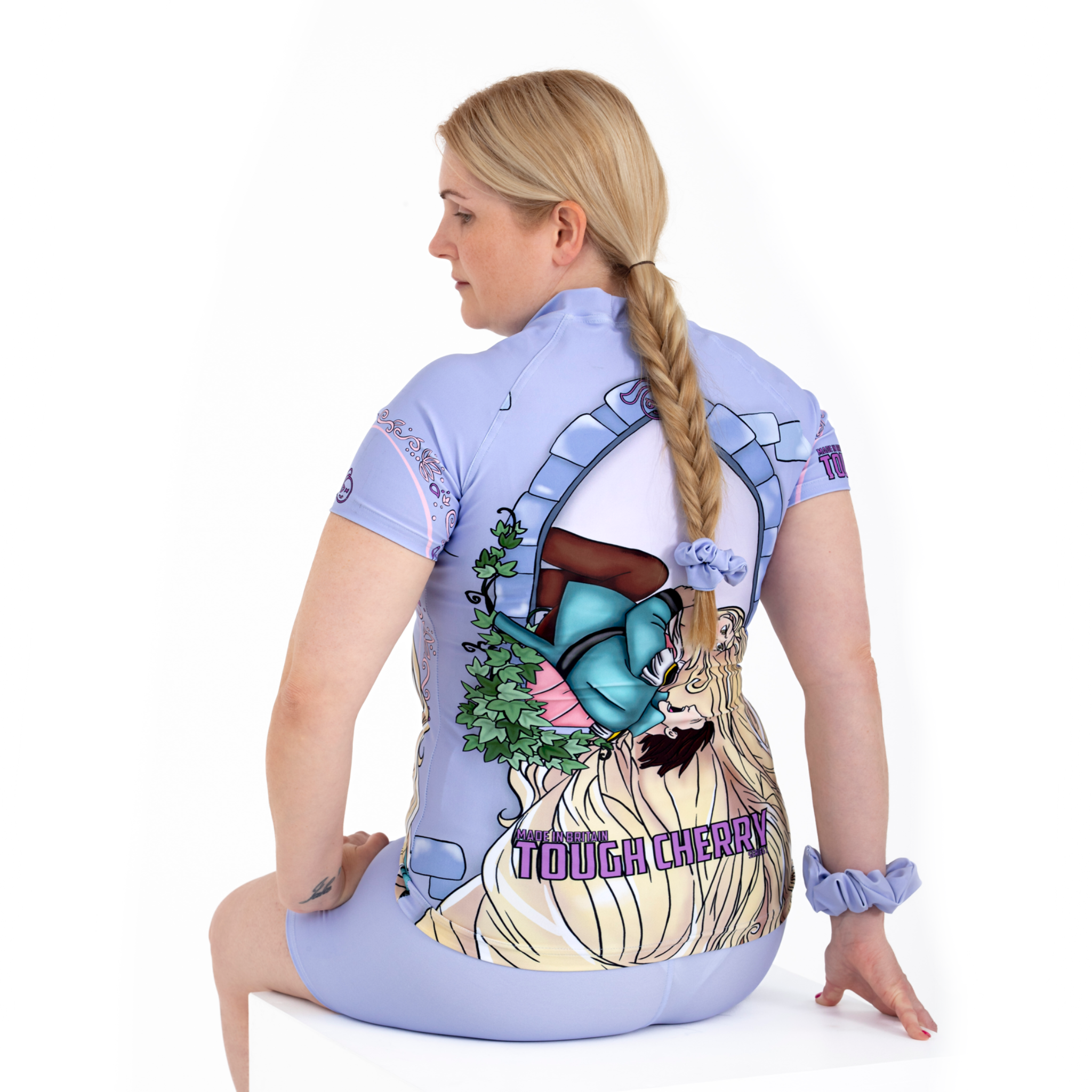 Women's and Girl's short sleeved rash guard with princess rapunzel design in purple, back view