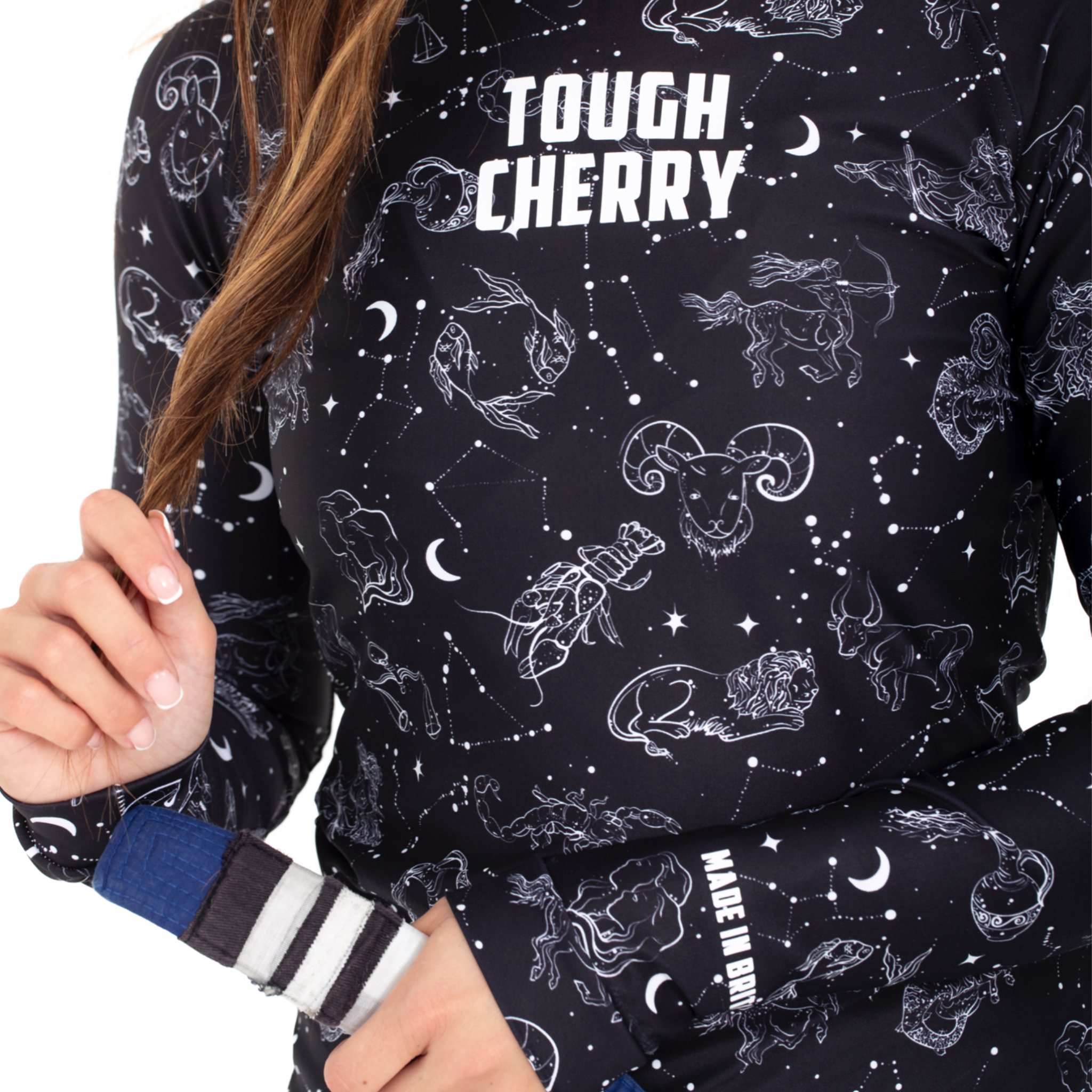 Women's and Girls Long and short sleeved rash guard, constellation and star sign black and white print, close view 