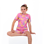 Women's and kids pink and white flower daisy design, short and long sleeved rash guard, girl sat view