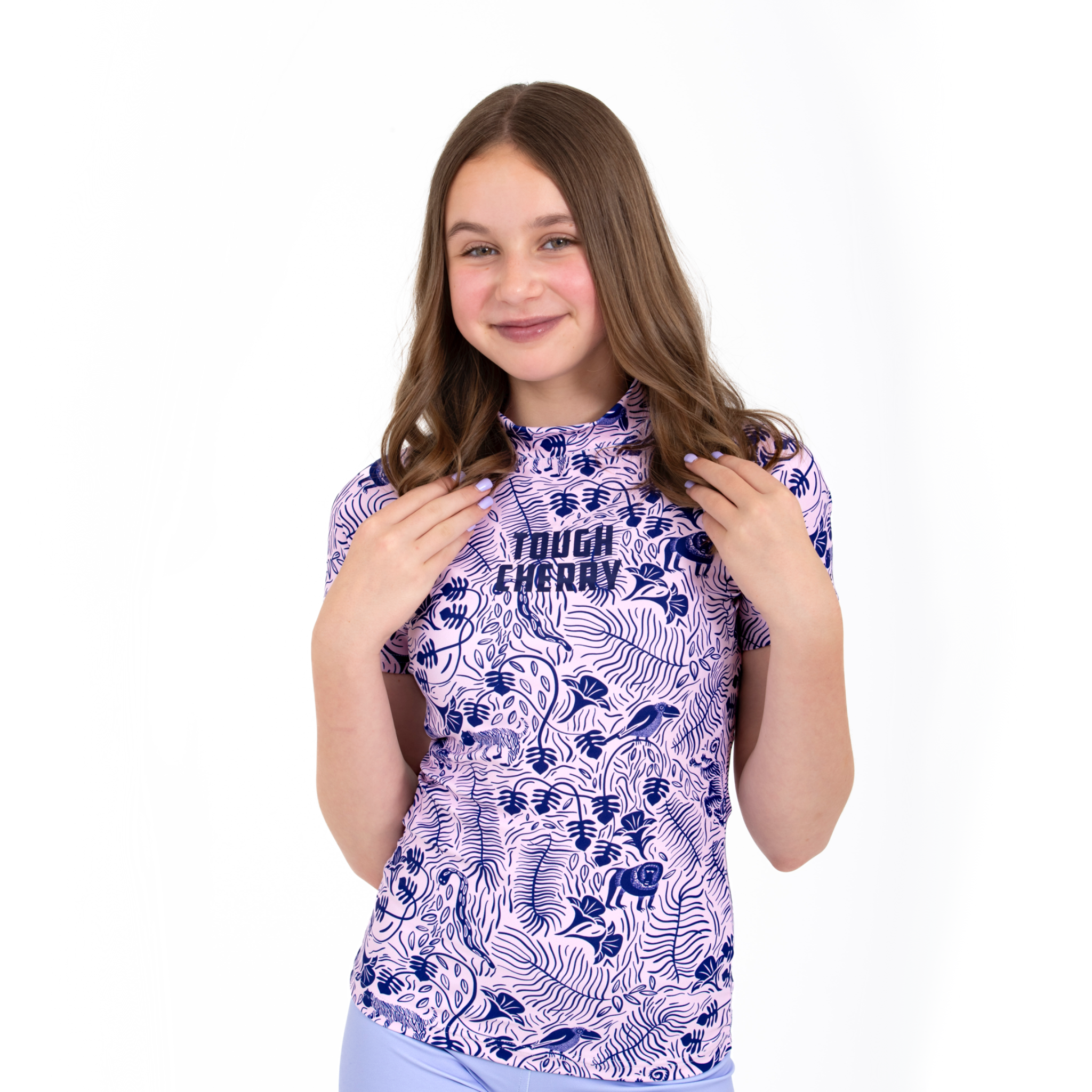 Women's and kids short and long sleeved rash guard, pink and purple jungle design, front view 2