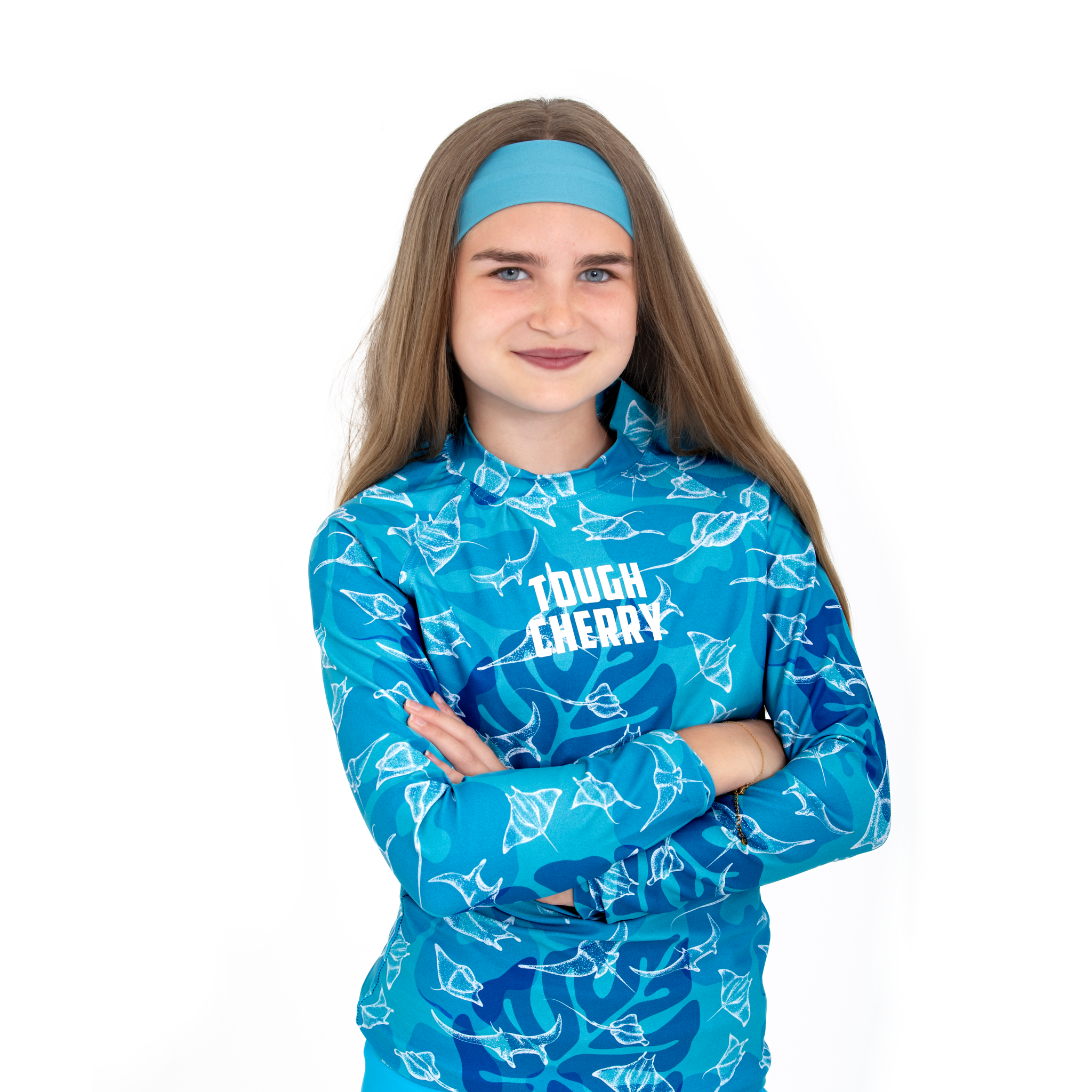 Women's and kids short or long sleeved blue rah guard with manta ray pattern, front view