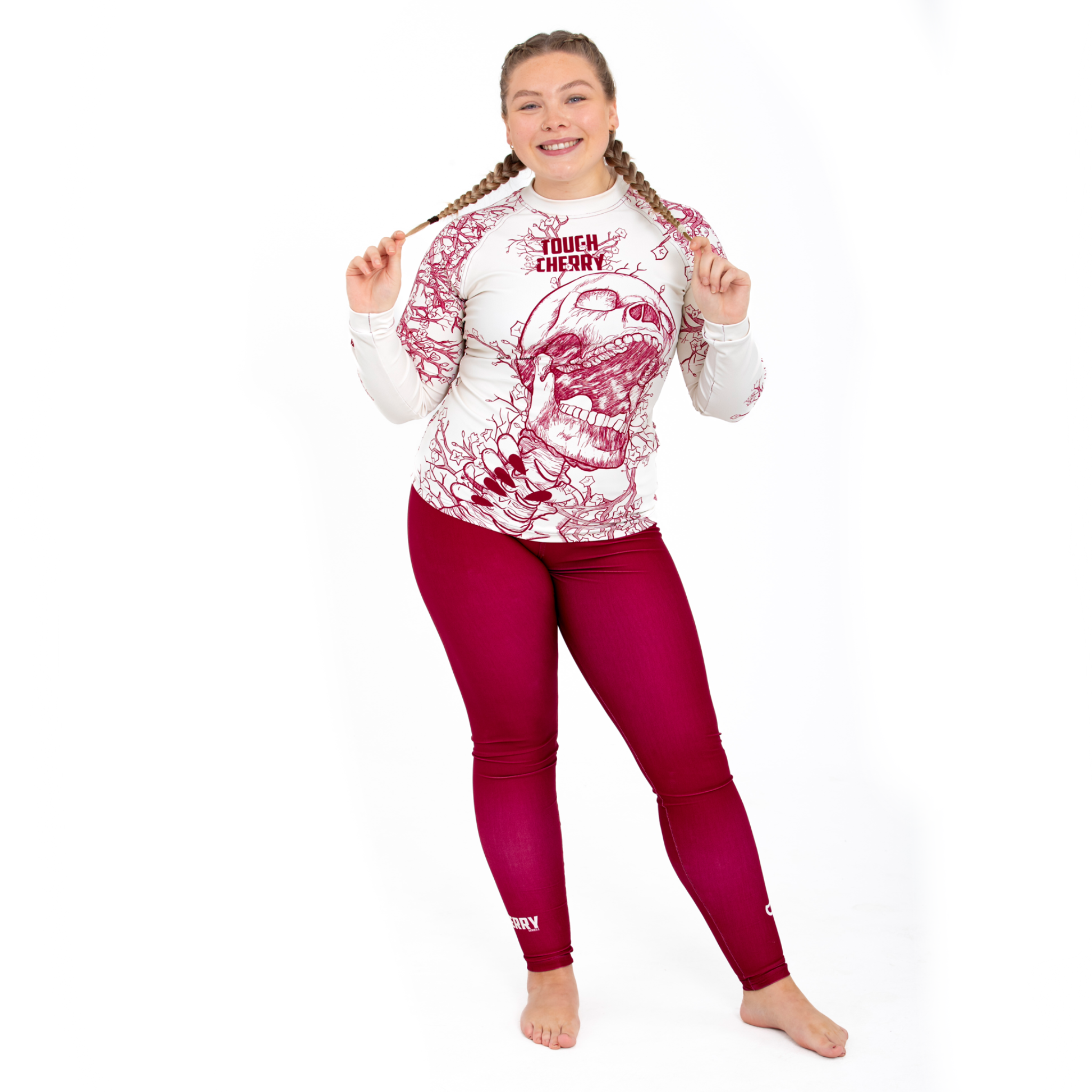 Women's, girl's long sleeved rash guard, skull and cherry blossom design, full body view